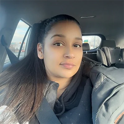 Valeria Delgado smiling in a black jacket.